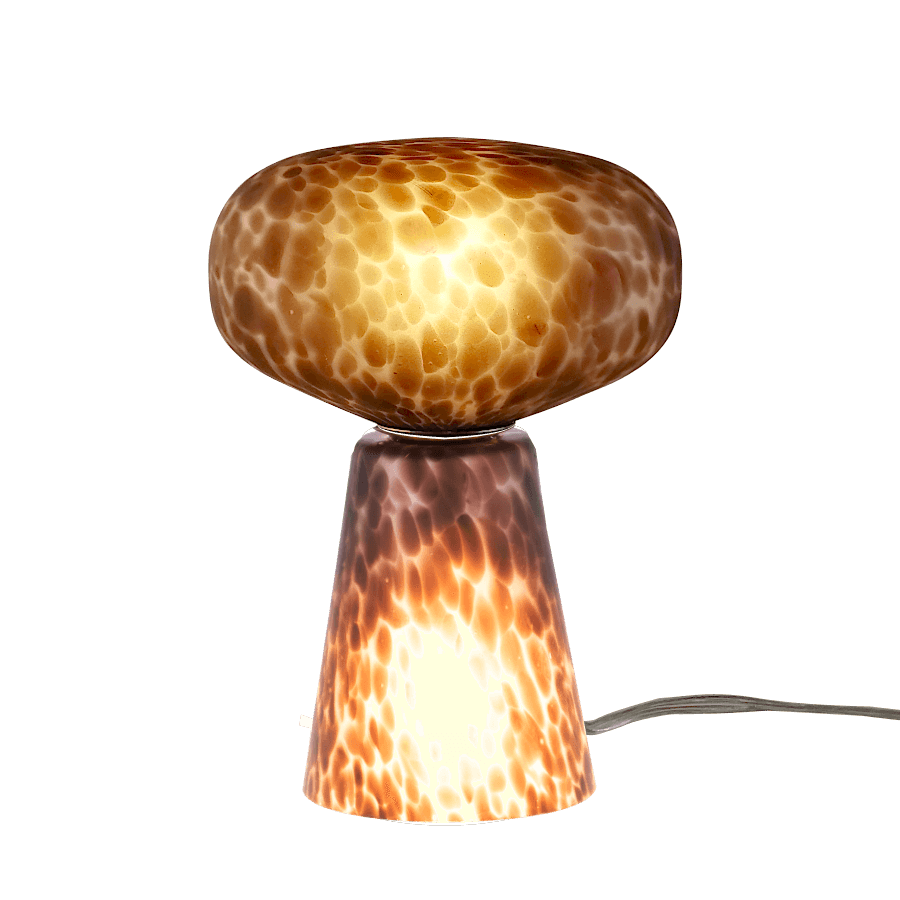 Lampe décorative en verre, la base conique et le dôme sont allumés.