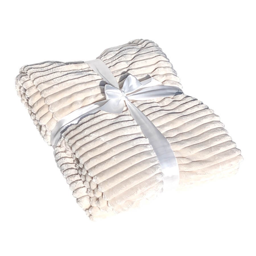 Plaid ultra-moelleux présenté avec son ruban, une idée cadeau cocooning.