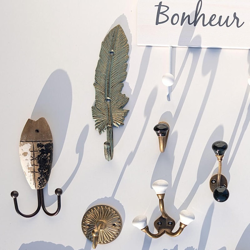 Patère plume fonte gris doré H21.5  | Deco-Delight.com