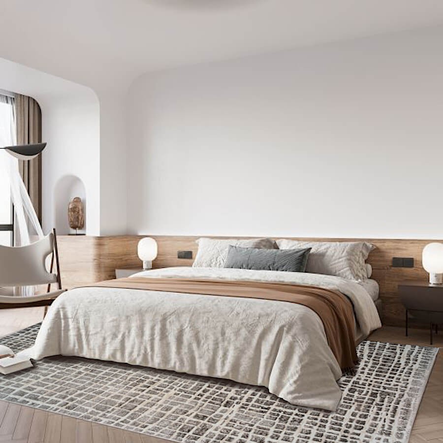 Tapis géométrique gris créant une atmosphère raffinée dans une chambre.
