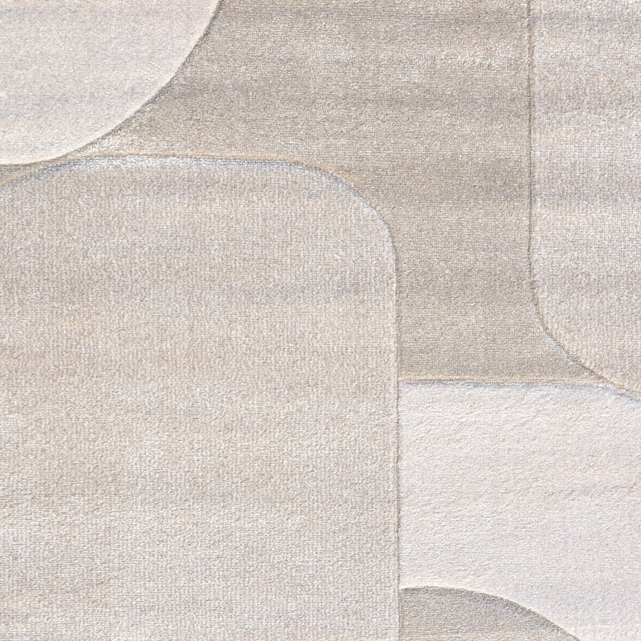 Détail du velours frisé sculpté et des nuances de beige clair.