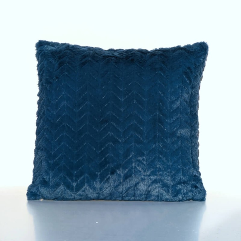 Vue isolée du coussin bleu mettant en avant son aspect moelleux et structuré.