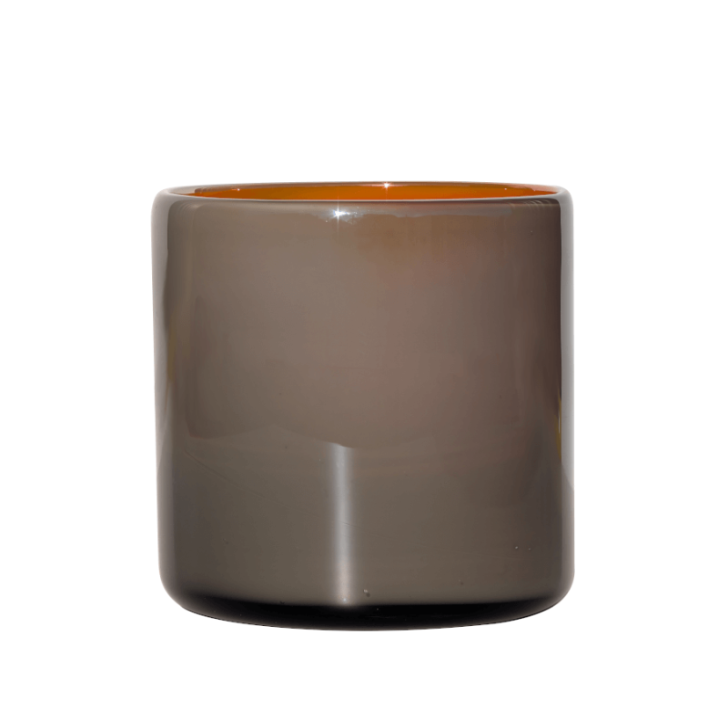 Photophore en verre bicolore gris et orange, hauteur et diamètre 12 cm.