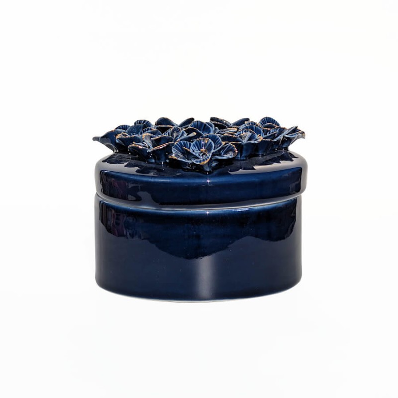 Vue de profil de la boîte décorative bleu marine et or de diamètre 11 cm.