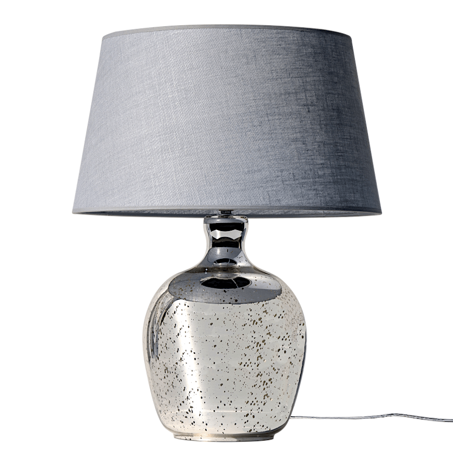 Lampe en verre mercurisé avec son abat-jour en lin cendré sur fond blanc.