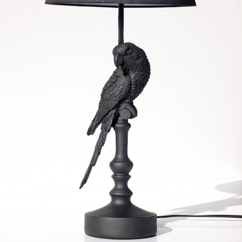 Vue de face de la lampe Perroquet éteinte, socle et oiseau.