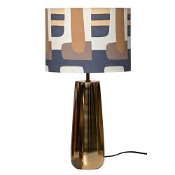 Lampe à poser design avec pied en métal doré et abat-jour en coton aux motifs graphiques rétro.