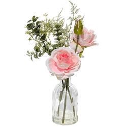 Composition florale artificielle de roses roses et feuillage dans un vase en verre transparent avec effet "eau solide".
