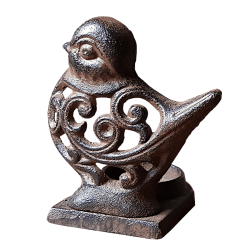 Bougeoir oiseau en fonte marron avec motifs arabesques ajourés.